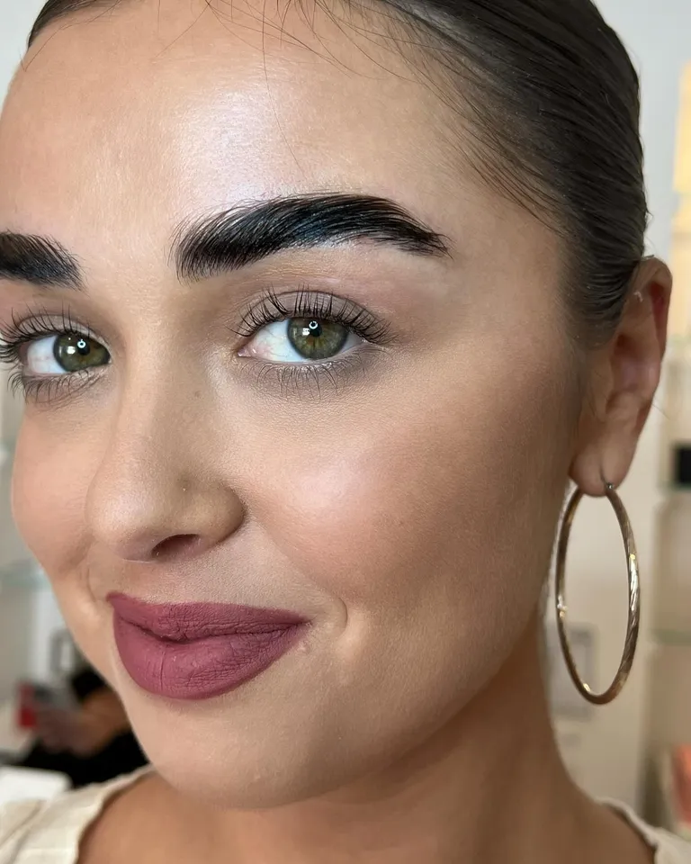 Portrait showing naturally curled lashes after a lash lift, creating a defined open-eye effect by Made by Marissa.