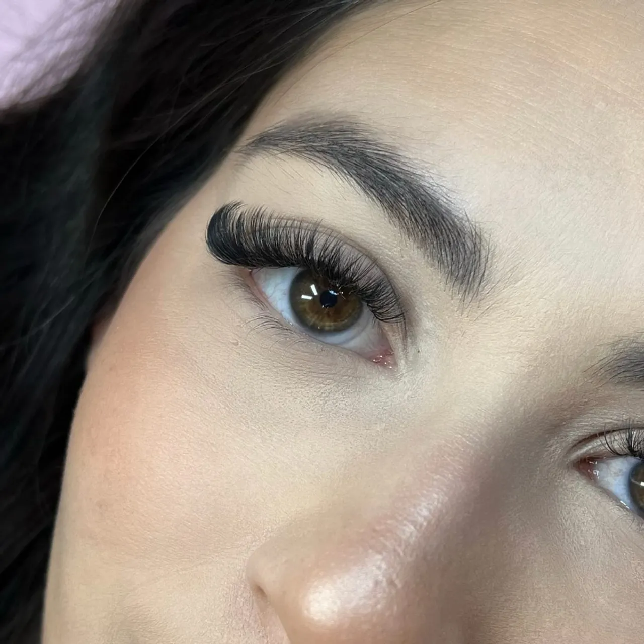 Before-and-after comparison of natural lashes and a soft cat-eye volume eyelash extension set by Made by Marissa